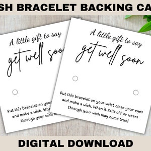 May include: Two white cards with black text that reads "A little gift to say get well soon". The cards have two holes punched in them. The text on the cards is for a wish bracelet backing card.