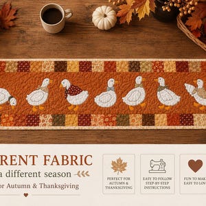 May include: A rectangular quilted table runner featuring a central orange panel with seven white goose appliqu&eacute;s wearing various patterned scarves and bows, bordered by a patchwork of autumn-colored floral and geometric fabric squares.
