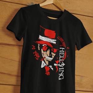 May include: Black t-shirt with a red and white illustration of a character with a top hat and sunglasses. The text "HELLSING" is printed vertically on the right side of the shirt.