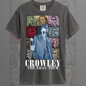 May include: Pepper color t-shirt featuring a graphic of a man in sunglasses, surrounded by other images of the same man. The text "CROWLEY THE ERAS TOUR" is printed in white below the images. The shirt is a crew neck.