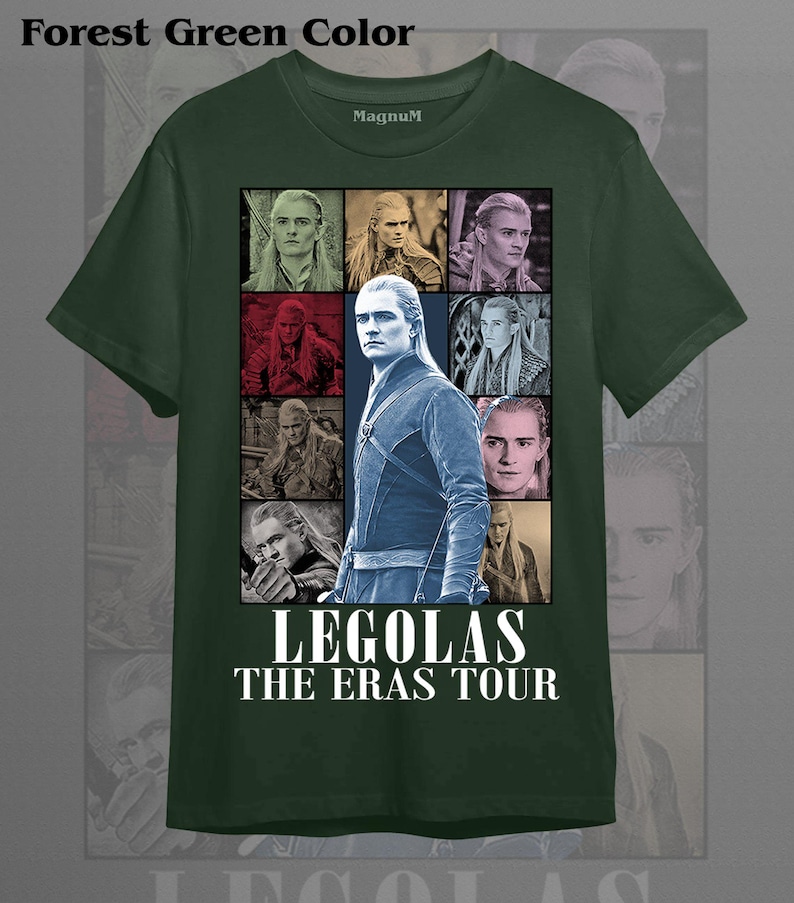 May include: Forest green t-shirt featuring a collage of images of Legolas, with the text "LEGOLAS THE ERAS TOUR" in white. The shirt has a crew neck and short sleeves. The brand name "Magnum" is printed on the upper chest.