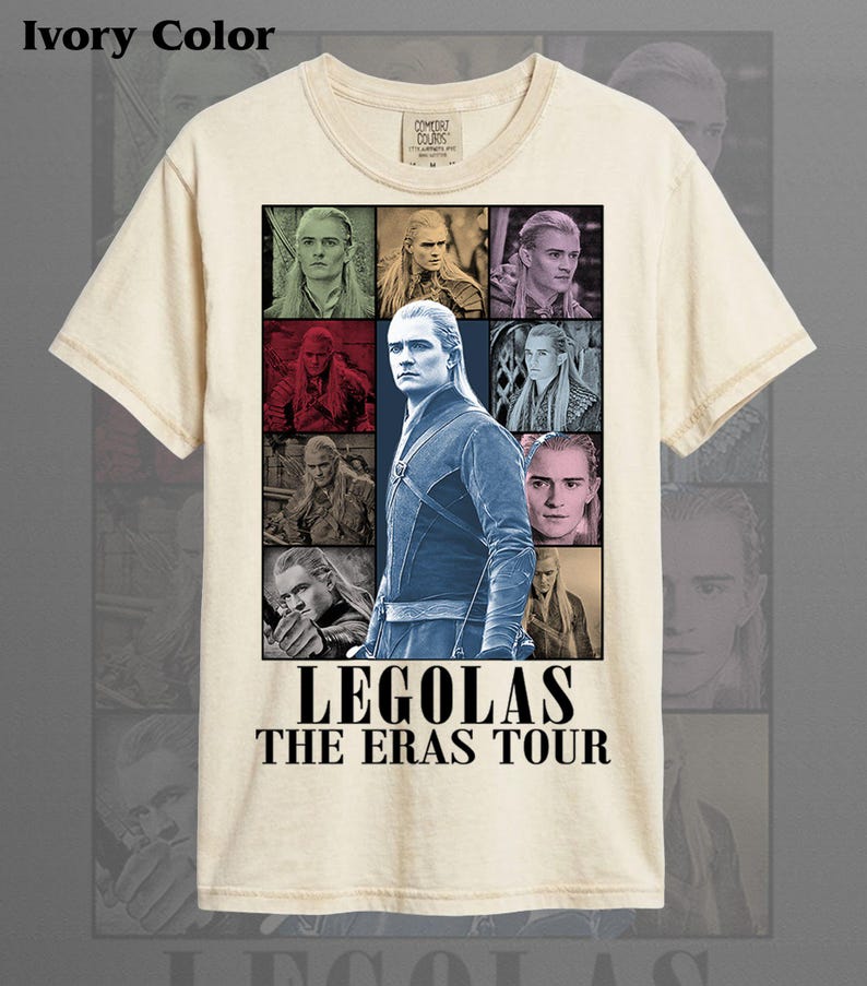 May include: Ivory-colored t-shirt featuring a graphic of Legolas from The Lord of the Rings. The design includes multiple images of the character and the text "LEGOLAS THE ERAS TOUR" in a bold font. The shirt is made of a soft material.
