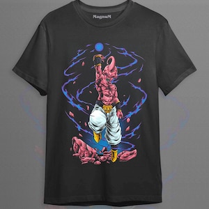 May include: Black t-shirt featuring a pink cartoon character with white pants and yellow boots, reaching for a blue orb. The design includes blue and purple energy effects. The word "Magnum" is printed on the top of the shirt.