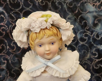 Vintage Avon Porcelain Doll in White with Light Gold Polka Dots with Blue Bows