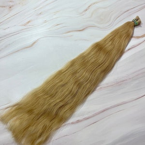 スラブヘアエクステンション、ウェーブヘア 100 gr、天然人毛 60 cm/23.6 インチ。100 gr あたりの価格