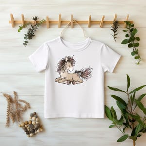 Einhorn liegend Katzengold Bügelbild 19x15 cm – süßes DTF Bügelmotiv Mädchen DIY Transferfolie Kinder Einhorn Kleidung