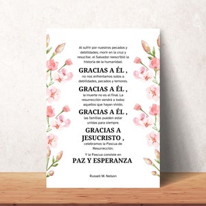 May include: A white card with pink floral accents and the text "Gracias a Él, Gracias a Él, Gracias a Él, Gracias a Jesucristo, Paz y Esperanza" and the name "Russell M. Nelson".