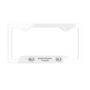 May include: White plastic license plate frame with the text "Wineglass Marathon, Corning NY" and the number "26.2" on either side.