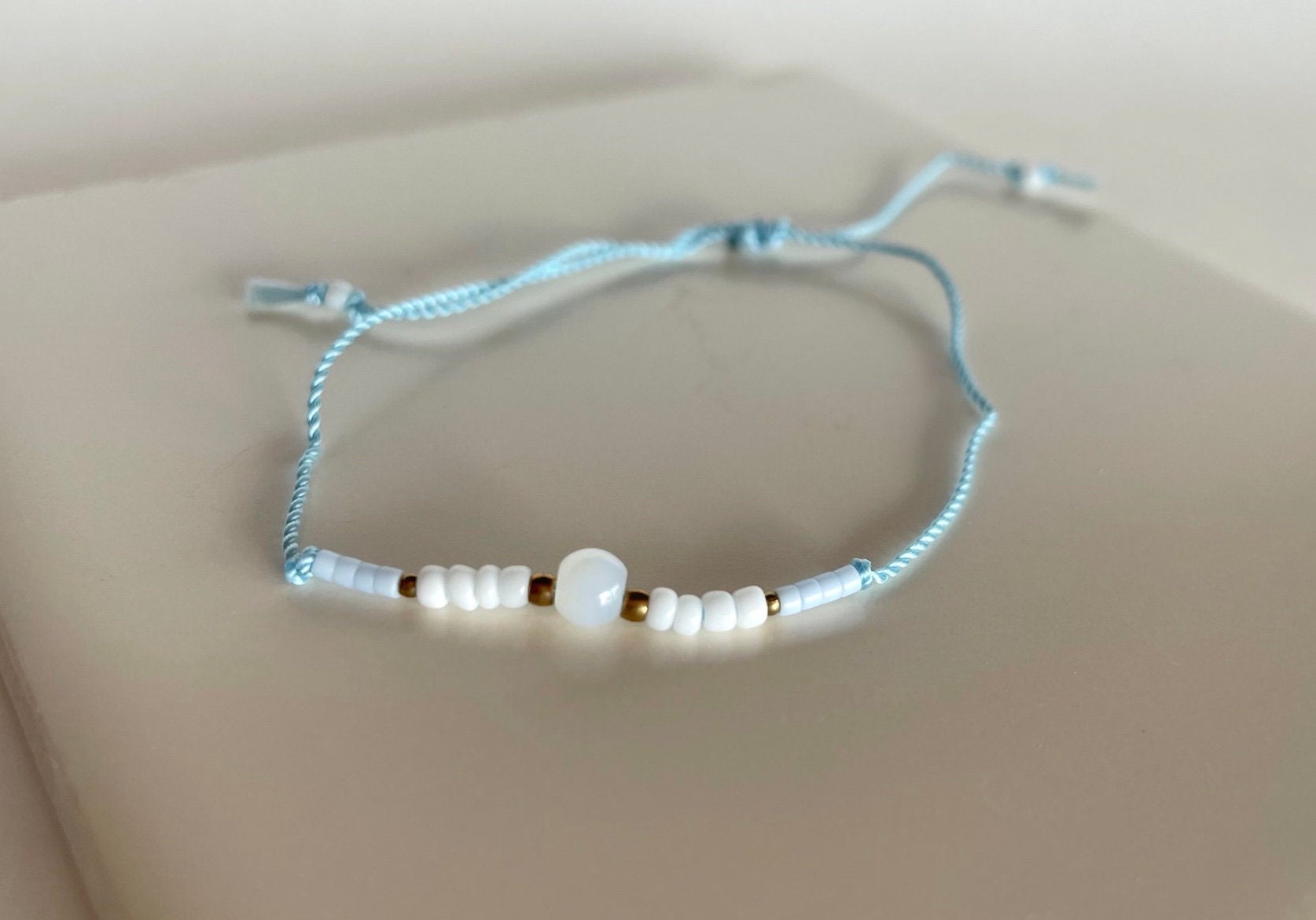 Louis Vuitton White/Blue Beaded Bracelet - Yoogi's Closet