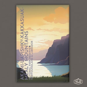 May include: A colorful illustration of a mountain range with a lake in the foreground. The text "AKAMI-UAPISHKU-KAKKASUAK- MEALY MOUNTAINS NATIONAL PARK RESERVE NEWFOUNDLAND & LABRADOR" is printed on the image.