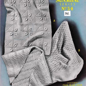 May include: An image of three knitted baby items: a pram or cot cover, a head shawl, and a shawl. The cover features a floral design, while the shawl has a wavy pattern. The text "Sirdar Sunshine Series No. 54" is visible.