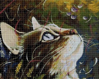 May include: A close-up of a cat's face looking up at a purple flower with a blurred background of green and yellow foliage.