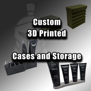 May include: Custom 3D printed cases and storage solutions. The image displays various black storage containers, including a case for grooming tools and a stand for skincare products. The text "MANSCAPED" is visible on one of the cases.