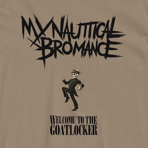 May include: Tan t-shirt with the text "MY NAUTICAL BROMANCE" in black, above a skeleton figure in a marching band uniform. Below the figure is the text "WELCOME TO THE GOATLOCKER" in black.