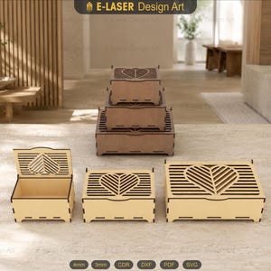 May include: A collection of light-colored wooden boxes in various sizes, featuring laser-cut heart designs on the lids. The boxes are arranged in a stack and side-by-side, showcasing rectangular shapes with slotted edges and open-work patterns.