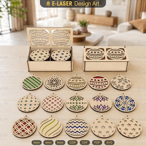 May include: A collection of laser-cut wooden Christmas ornaments featuring various geometric, star, and snowflake patterns. The set includes two rectangular wooden storage boxes with lids, and fifteen circular ornaments with colorful inserts.