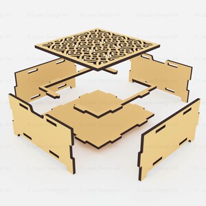Puede incluir: Un kit de caja de madera de color marr&oacute;n claro desmontado con paneles planos y ranuras cortadas con l&aacute;ser para su montaje. El panel superior muestra un intrincado patr&oacute;n sim&eacute;trico recortado, mientras que la base y los laterales son lisos.