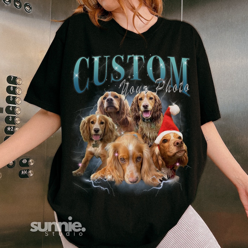 May include: Black t-shirt with a graphic of five dogs in a lightning bolt design. The text "CUSTOM Your Photo" is above the dogs.
