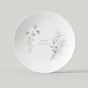 May include: White ceramic plate with a green and black eucalyptus leaf design. The text "CLASSIC EUCALYPTUS" is printed on the plate.
