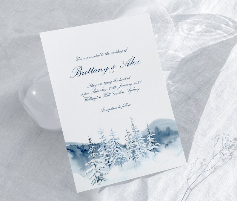 May include: A wedding invitation with a watercolor illustration of a snowy forest scene. The invitation reads "You are invited to the wedding of Brittany & Alex. They are tying the knot at 5 pm Saturday, 25th January 2023 Wellington Hall Garden, Sydney. Reception to follow."