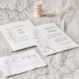 May include: A set of wedding stationery with a simple, elegant design. The cards feature a black and white illustration of eucalyptus leaves and the text "Save the Date" and "Richard and Teresa".