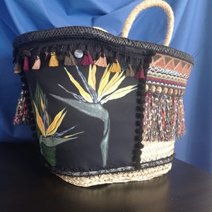 Birds of paradise. Coffa of dwarf palm woven, painted and decorated by hand