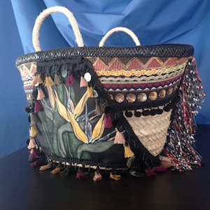 Birds of paradise. Coffa of dwarf palm woven, painted and decorated by hand