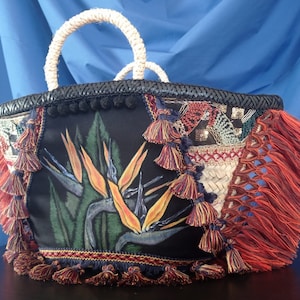Birds of paradise. Coffa of dwarf palm woven, painted and decorated by hand