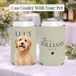 May include: Two personalized can coolers. One features a golden retriever portrait with the name "LUCY". The other displays "the WILLIAMS" with a date and a heart. Text at the top reads "Can Cooler With Your Pet".