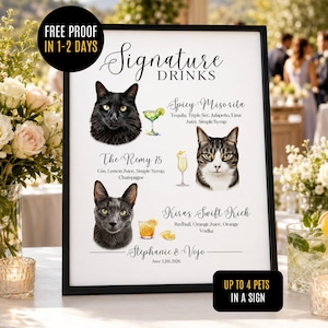 May include: A framed white sign titled Signature Drinks featuring illustrations of three cats and three cocktails with ingredient lists. The text includes Spicy Misorita, The Remy 75, Kira's Swift Kick, and the names Stephanie & Vojo with the date 12th June 2026.