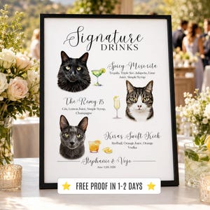May include: A framed sign with a black border displays "Signature Drinks" with illustrations of cats and cocktail recipes. The sign includes the names of the drinks and ingredients. The bottom of the sign has the names "Stephanie & Vojo" and the date.