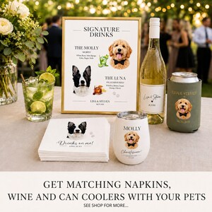 May include: A wedding signage set featuring a gold-framed menu titled Signature Drinks with illustrations of two dogs, a white wine bottle with a custom label, a white tumbler, a green can cooler, and a stack of napkins, all personalised with pet portraits.