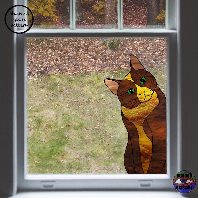 May include: A stained glass window design featuring a brown and yellow cat with green eyes, looking out of a window. The cat is positioned in the lower right corner of the window.