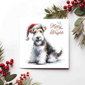 May include: A square Christmas card with a sketch of a dog wearing a Santa hat. The dog has a white, black, and brown coat. The words "Merry & Bright" are written in red script. Greenery and red berries decorate the edges of the card.