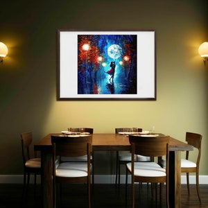 May include: A framed painting depicts a couple dancing under a full moon in a park at night. The artwork features vibrant blues, reds, and oranges, with streetlights illuminating the scene. The painting is displayed above a wooden dining table with chairs.