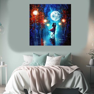 May include: A square canvas painting depicts a couple dancing under a full moon in a rainy, illuminated street scene. The artwork features vibrant blues, reds, and oranges, with the couple's silhouettes in the foreground. The painting hangs above a bed with a light pink blanket.