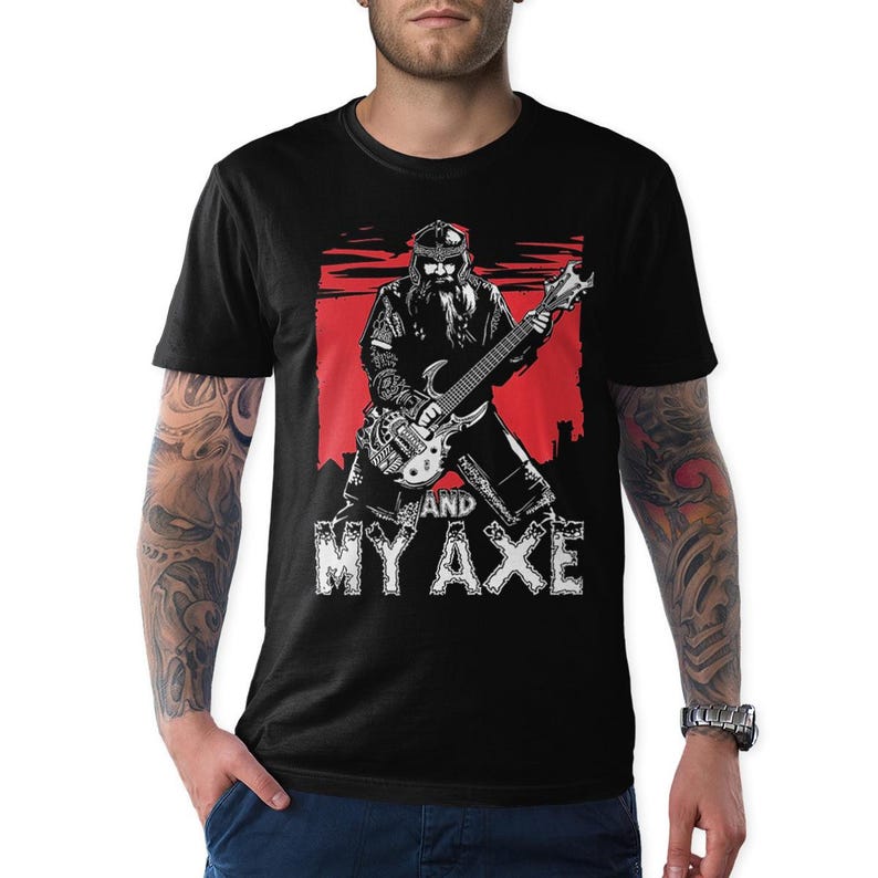 May include: Black t-shirt with a white graphic of a man with a beard playing a guitar and the text "And My Axe".