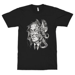 May include: Black t-shirt with a graphic print of a man's face with an octopus tentacle coming out of his eye.