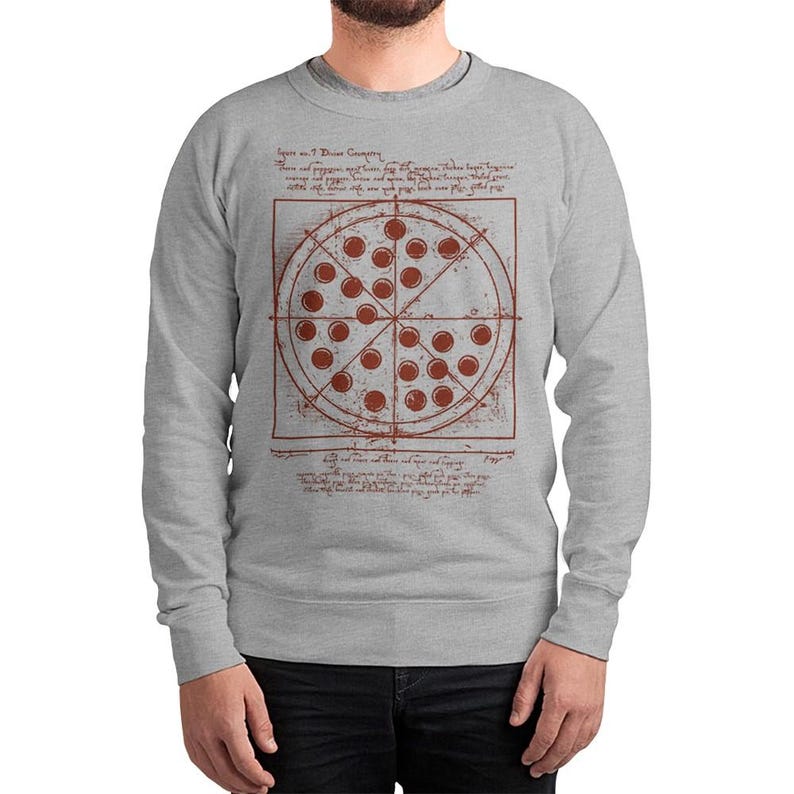 May include: A light gray sweatshirt featuring a pizza design with a Da Vinci-style diagram. The pizza has red pepperoni and is divided into slices. The design includes text in a handwritten font, adding a unique artistic touch.