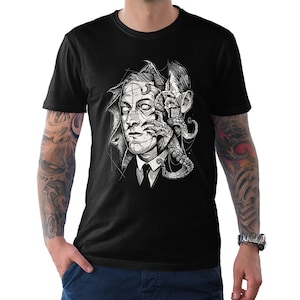 May include: Black t-shirt with a graphic print of a man's face with an octopus tentacle coming out of his head.