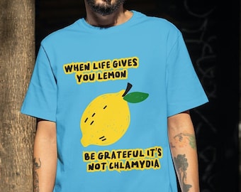 May include: A light blue t-shirt with a yellow lemon graphic and the text "When life gives you lemon, be grateful it's not chlamydia."