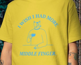 May include: A yellow t-shirt with a blue graphic of a cat holding a cup of coffee. The text on the shirt reads "I wish I had more middle finger."