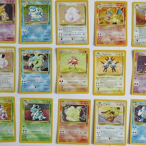 Pokémon Lot de 20 cartes Pokémon différentes + 1 lot de boosters aléatoires  - Cartes originales allemandes