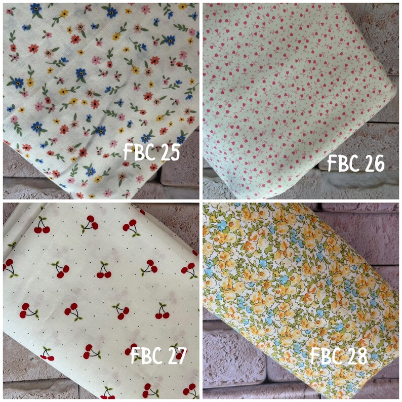May include: Four fabric swatches featuring distinct patterns: FBC 25 shows a white background with small blue, yellow, and pink flowers; FBC 26 has a light green base with tiny pink floral sprigs; FBC 27 displays red cherries on a white dotted background; FBC 28 features dense yellow and blue floral clusters.