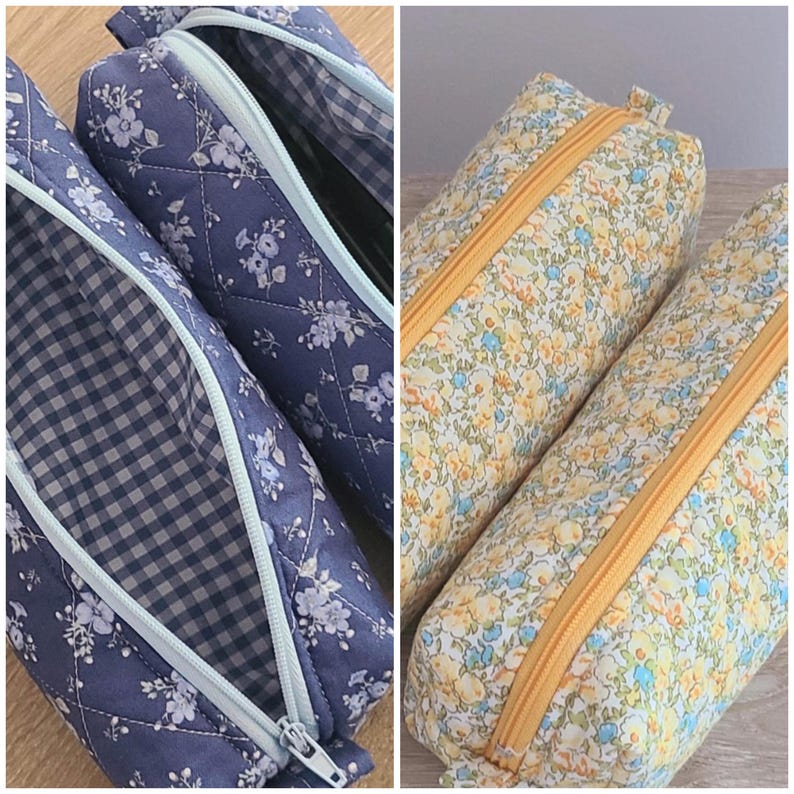 Puede incluir: Dos estuches acolchados. El estuche de la izquierda es azul con un patr&oacute;n floral blanco, una cremallera azul claro y un interior de cuadros vichy azul y blanco. El estuche de la derecha tiene un estampado floral amarillo y azul.