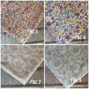 May include: Four fabric swatches featuring floral patterns. FBC 5 displays pink and green flowers on a cream background. FBC 6 shows purple, blue, and yellow flowers. FBC 7 features a pink monochromatic floral print. FBC 8 shows a blue floral print.