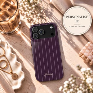 May include: A dark purple smartphone case featuring thin vertical white pinstripes and the name Jessica printed in white script at the bottom. The case has a black camera module cutout with three circular lenses and a flash, designed for a mobile device.