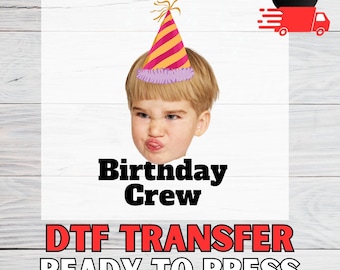 May include: A DTF transfer featuring a child's face wearing a party hat. The hat is striped with pink and yellow. The text "Birtnday Crew" and "DTF TRANSFER READY TO PRESS" are below the image.