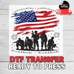 May include: A patriotic design featuring the American flag with a distressed effect, silhouetted soldiers, and the phrases "Land Of The Free Because Of The Brave" and "Honor And Remember." The words "DTF TRANSFER READY TO PRESS" are also included.