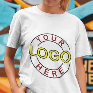 May include: A white t-shirt with a red circle and the text "YOUR LOGO HERE" in yellow letters.